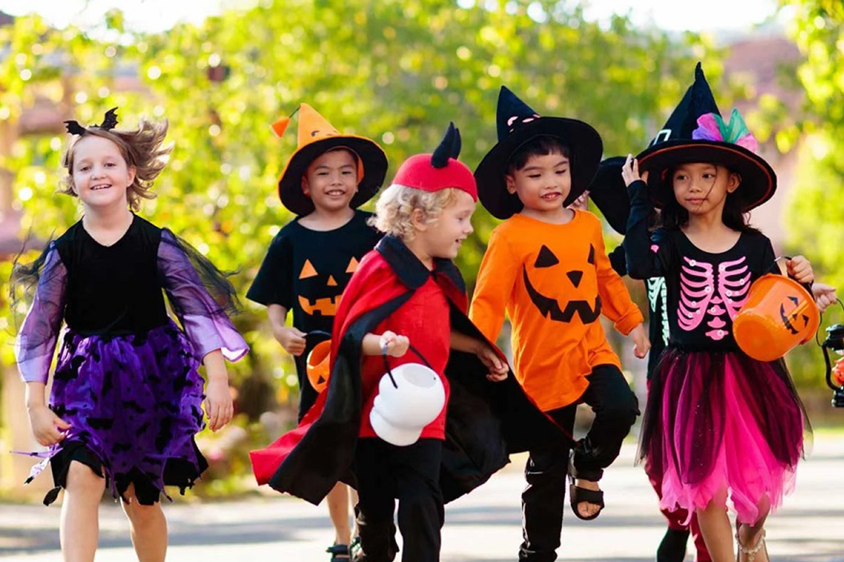 Image of Kids dressed up for Halloween and trick or treating